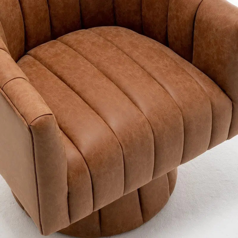 Fauteuil pivotant SEYNAR style milieu du siècle, en cuir PU capitonné, forme tonneau.