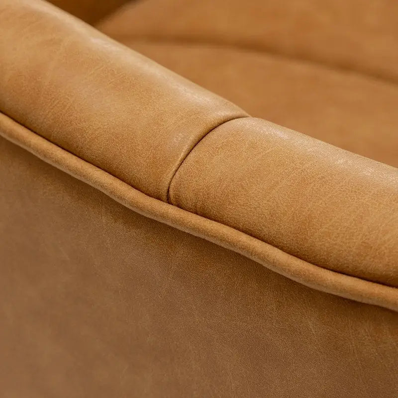 Fauteuil pivotant SEYNAR style milieu du siècle, en cuir PU capitonné, forme tonneau.