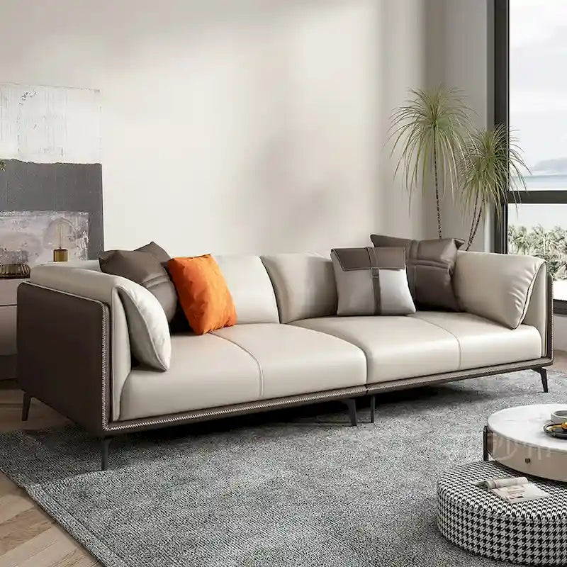 Canapé deux places avec accoudoirs rembourrés en similicuir et coussins réversibles